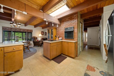 Set on a beautiful 0.52-acre lot surrounded by towering pines on Pinetop Lakes Country Club in Arizona - for sale on GolfHomes.com, golf home, golf lot