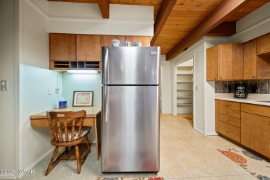 Set on a beautiful 0.52-acre lot surrounded by towering pines on Pinetop Lakes Country Club in Arizona - for sale on GolfHomes.com, golf home, golf lot