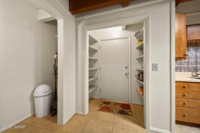 Set on a beautiful 0.52-acre lot surrounded by towering pines on Pinetop Lakes Country Club in Arizona - for sale on GolfHomes.com, golf home, golf lot