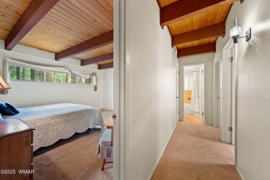 Set on a beautiful 0.52-acre lot surrounded by towering pines on Pinetop Lakes Country Club in Arizona - for sale on GolfHomes.com, golf home, golf lot