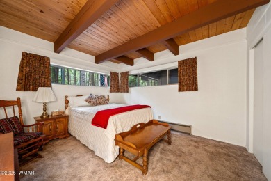 Set on a beautiful 0.52-acre lot surrounded by towering pines on Pinetop Lakes Country Club in Arizona - for sale on GolfHomes.com, golf home, golf lot