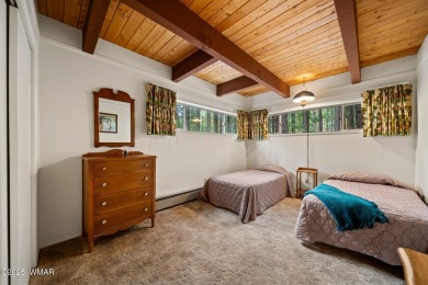 Set on a beautiful 0.52-acre lot surrounded by towering pines on Pinetop Lakes Country Club in Arizona - for sale on GolfHomes.com, golf home, golf lot