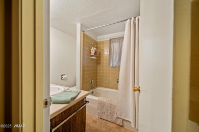 Set on a beautiful 0.52-acre lot surrounded by towering pines on Pinetop Lakes Country Club in Arizona - for sale on GolfHomes.com, golf home, golf lot