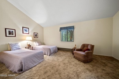 Set on a beautiful 0.52-acre lot surrounded by towering pines on Pinetop Lakes Country Club in Arizona - for sale on GolfHomes.com, golf home, golf lot