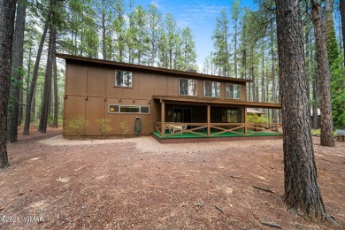 Set on a beautiful 0.52-acre lot surrounded by towering pines on Pinetop Lakes Country Club in Arizona - for sale on GolfHomes.com, golf home, golf lot