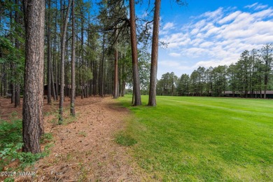 Set on a beautiful 0.52-acre lot surrounded by towering pines on Pinetop Lakes Country Club in Arizona - for sale on GolfHomes.com, golf home, golf lot