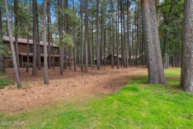Set on a beautiful 0.52-acre lot surrounded by towering pines on Pinetop Lakes Country Club in Arizona - for sale on GolfHomes.com, golf home, golf lot