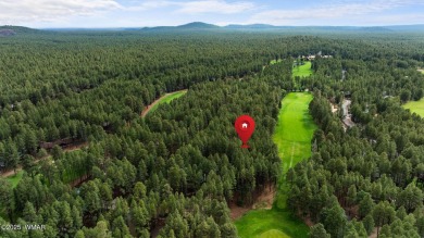 Set on a beautiful 0.52-acre lot surrounded by towering pines on Pinetop Lakes Country Club in Arizona - for sale on GolfHomes.com, golf home, golf lot
