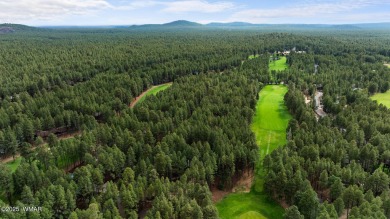 Set on a beautiful 0.52-acre lot surrounded by towering pines on Pinetop Lakes Country Club in Arizona - for sale on GolfHomes.com, golf home, golf lot