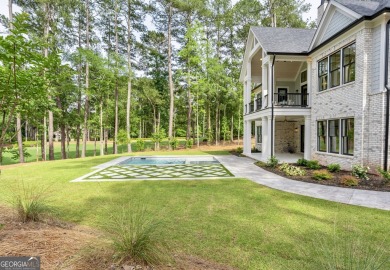This meticulous custom golf residence is impeccably built with on Reynolds Lake Oconee - The Oconee in Georgia - for sale on GolfHomes.com, golf home, golf lot