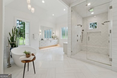 Experience timeless luxury at 4020 Cottage Park Ct, nestled on Manor Golf and Country Club in Georgia - for sale on GolfHomes.com, golf home, golf lot