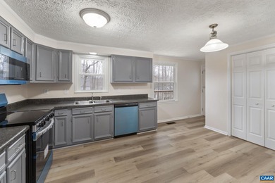 Enjoy effortless single-level living in a desirable resort-style on Lake Monticello Golf Course in Virginia - for sale on GolfHomes.com, golf home, golf lot