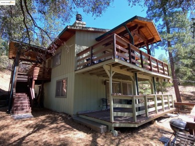 This cabin in the pines called 'Lil Oak Hill' is beautifully on Pine Mountain Lake Country Club in California - for sale on GolfHomes.com, golf home, golf lot