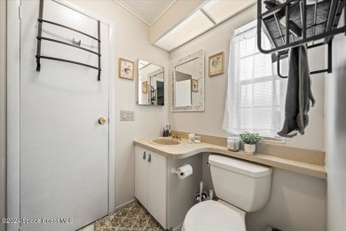 Charming 2-Bedroom Home with Golf Course Views! This on Barefoot Bay Golf Course in Florida - for sale on GolfHomes.com, golf home, golf lot