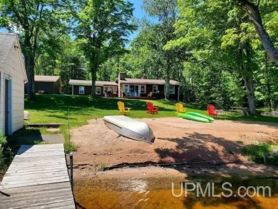 Enjoy the quaint rustic ambience of this northwoods cottage on Wyandotte Hills Golf Course in Michigan - for sale on GolfHomes.com, golf home, golf lot