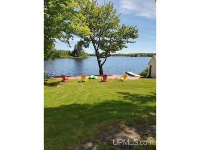 Enjoy the quaint rustic ambience of this northwoods cottage on Wyandotte Hills Golf Course in Michigan - for sale on GolfHomes.com, golf home, golf lot