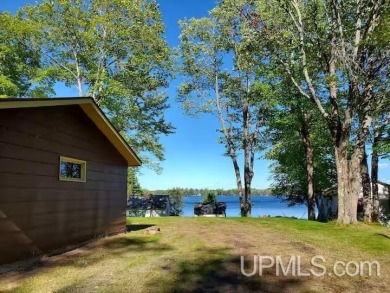 Enjoy the quaint rustic ambience of this northwoods cottage on Wyandotte Hills Golf Course in Michigan - for sale on GolfHomes.com, golf home, golf lot