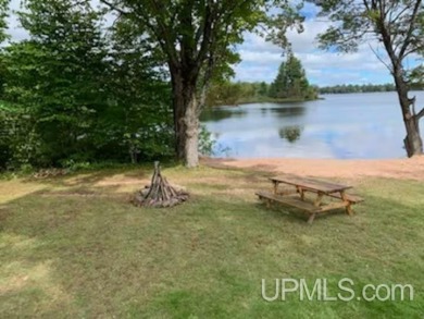 Enjoy the quaint rustic ambience of this northwoods cottage on Wyandotte Hills Golf Course in Michigan - for sale on GolfHomes.com, golf home, golf lot