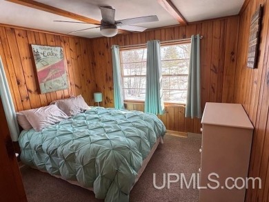 Enjoy the quaint rustic ambience of this northwoods cottage on Wyandotte Hills Golf Course in Michigan - for sale on GolfHomes.com, golf home, golf lot