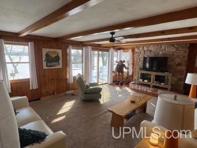 Enjoy the quaint rustic ambience of this northwoods cottage on Wyandotte Hills Golf Course in Michigan - for sale on GolfHomes.com, golf home, golf lot