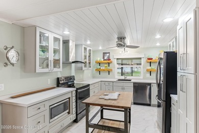 Come see this magnificently updated 2BR/2BA home in the heart of on Barefoot Bay Golf Course in Florida - for sale on GolfHomes.com, golf home, golf lot