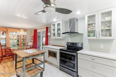 Come see this magnificently updated 2BR/2BA home in the heart of on Barefoot Bay Golf Course in Florida - for sale on GolfHomes.com, golf home, golf lot