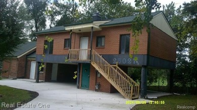 PROPERTY REPAIRED.  BEAUTIFUL CURB APPEAL ON THIS RAISED RANCH on Western Golf and Country Club in Michigan - for sale on GolfHomes.com, golf home, golf lot