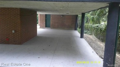 PROPERTY REPAIRED.  BEAUTIFUL CURB APPEAL ON THIS RAISED RANCH on Western Golf and Country Club in Michigan - for sale on GolfHomes.com, golf home, golf lot