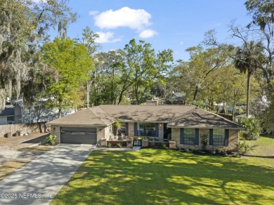 ALL BRICK BEAUTY situated on one of the largest lots in Pablo on Queens Harbour Yacht and Country Club in Florida - for sale on GolfHomes.com, golf home, golf lot