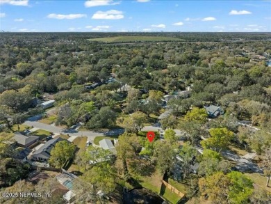 ALL BRICK BEAUTY situated on one of the largest lots in Pablo on Queens Harbour Yacht and Country Club in Florida - for sale on GolfHomes.com, golf home, golf lot