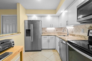 THE LOWEST PRICED GROUND FLOOR UNIT IN DUNBAR WOODS! UPDATED AND on PGA National Golf Club in Florida - for sale on GolfHomes.com, golf home, golf lot