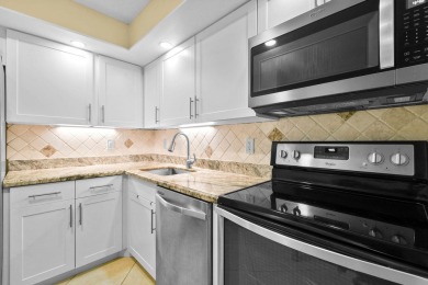 THE LOWEST PRICED GROUND FLOOR UNIT IN DUNBAR WOODS! UPDATED AND on PGA National Golf Club in Florida - for sale on GolfHomes.com, golf home, golf lot