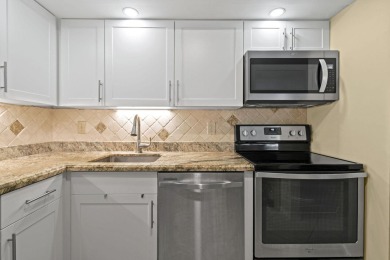THE LOWEST PRICED GROUND FLOOR UNIT IN DUNBAR WOODS! UPDATED AND on PGA National Golf Club in Florida - for sale on GolfHomes.com, golf home, golf lot