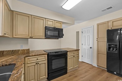 Beautifully updated 2-bedroom, 2-bath home in the desirable on Island Green Golf Club in South Carolina - for sale on GolfHomes.com, golf home, golf lot