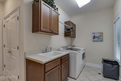 Location, location, location! This beautiful custom-built home on Toqua Golf Course - Loudon County in Tennessee - for sale on GolfHomes.com, golf home, golf lot