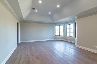 Welcome to this elegant 4-bedroom, 4.2-bath home, situated on a on Royal Melbourne in Illinois - for sale on GolfHomes.com, golf home, golf lot