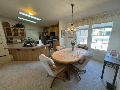 This home is in a beautiful 55+ age qualified resort community on Voyager RV Resort and Golf Course in Arizona - for sale on GolfHomes.com, golf home, golf lot