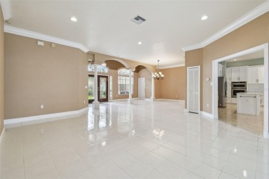 Stunning 4-bedroom, 3-bath pool home with spa on a serene pond on Crescent Oaks Country Club in Florida - for sale on GolfHomes.com, golf home, golf lot
