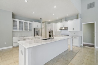 Stunning 4-bedroom, 3-bath pool home with spa on a serene pond on Crescent Oaks Country Club in Florida - for sale on GolfHomes.com, golf home, golf lot