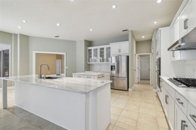 Stunning 4-bedroom, 3-bath pool home with spa on a serene pond on Crescent Oaks Country Club in Florida - for sale on GolfHomes.com, golf home, golf lot