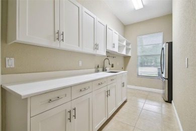 Stunning 4-bedroom, 3-bath pool home with spa on a serene pond on Crescent Oaks Country Club in Florida - for sale on GolfHomes.com, golf home, golf lot