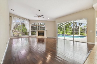 Stunning 4-bedroom, 3-bath pool home with spa on a serene pond on Crescent Oaks Country Club in Florida - for sale on GolfHomes.com, golf home, golf lot