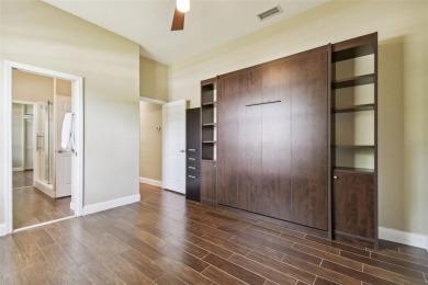 Stunning 4-bedroom, 3-bath pool home with spa on a serene pond on Crescent Oaks Country Club in Florida - for sale on GolfHomes.com, golf home, golf lot