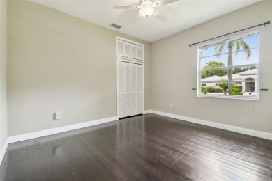 Stunning 4-bedroom, 3-bath pool home with spa on a serene pond on Crescent Oaks Country Club in Florida - for sale on GolfHomes.com, golf home, golf lot