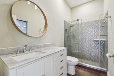 Stunning 4-bedroom, 3-bath pool home with spa on a serene pond on Crescent Oaks Country Club in Florida - for sale on GolfHomes.com, golf home, golf lot