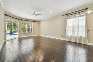 Stunning 4-bedroom, 3-bath pool home with spa on a serene pond on Crescent Oaks Country Club in Florida - for sale on GolfHomes.com, golf home, golf lot