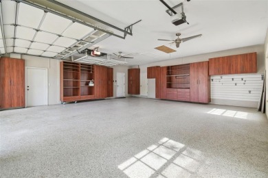 Stunning 4-bedroom, 3-bath pool home with spa on a serene pond on Crescent Oaks Country Club in Florida - for sale on GolfHomes.com, golf home, golf lot