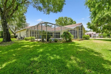 Stunning 4-bedroom, 3-bath pool home with spa on a serene pond on Crescent Oaks Country Club in Florida - for sale on GolfHomes.com, golf home, golf lot