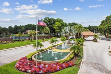Stunning 4-bedroom, 3-bath pool home with spa on a serene pond on Crescent Oaks Country Club in Florida - for sale on GolfHomes.com, golf home, golf lot
