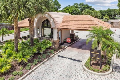Stunning 4-bedroom, 3-bath pool home with spa on a serene pond on Crescent Oaks Country Club in Florida - for sale on GolfHomes.com, golf home, golf lot